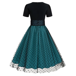 Detail of the back hidden zipper and retro polka dot mesh stitching on the A-line dress