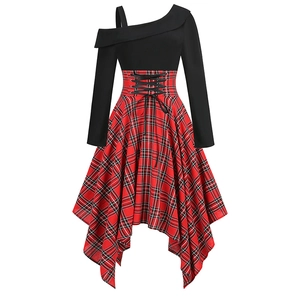 Detail of asymmetrical neckline and red plaid irregular hem on French style dress