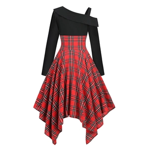Detail of red plaid irregular hem and black one-shoulder bodice of the dress