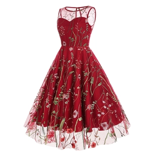 Detailed view of floral embroidery on a vintage red sleeveless evening party dress