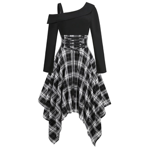 Detail of a vintage-style corset dress with lace-up waist and asymmetric plaid hem