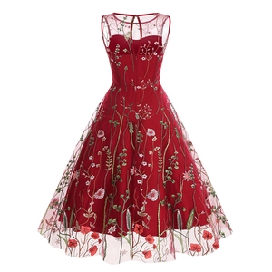 Detail of a deep red A-line dress with floral embroidery and mesh overlay on the back