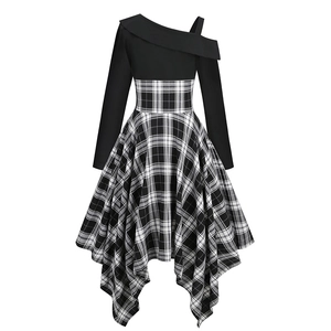 Detailed view of the asymmetric hemline and plaid pattern on this elegant dress