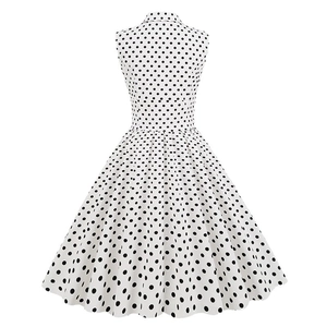 Vintage 1950s sleeveless polka dot A-line dress with lapel collar and wide swing skirt