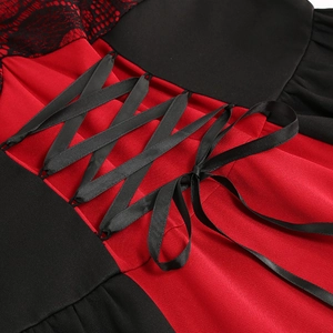 Detailed close-up of the vintage lace-up corset back on a red and black lace dress