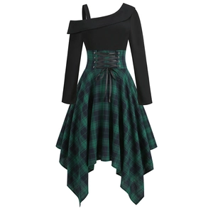 Detail of waist corset ribbons and green plaid irregular hem on women's gothic dress