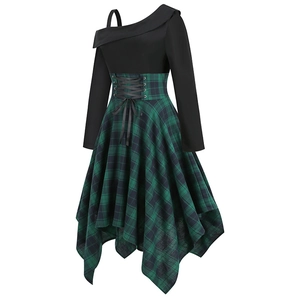 Detail of the irregular plaid hem and corset-style waist on the long sleeve dress