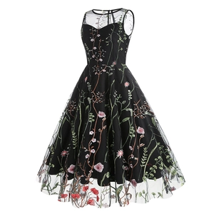 Close-up of vibrant floral embroidery on a black mesh sleeveless cocktail dress