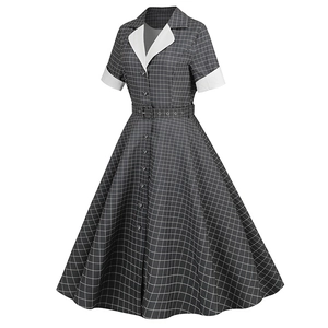 Detail of vintage plaid dress with contrast lapel, buttons and matching eyelet belt