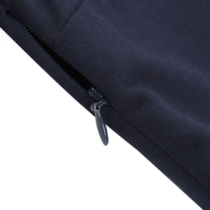 Macro detail of navy blue dress fabric featuring a seamless hidden zipper closure