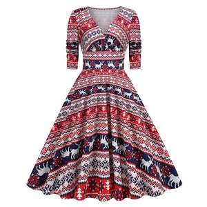 Detail of vintage Christmas A-line dress featuring reindeer and snowflake patterns