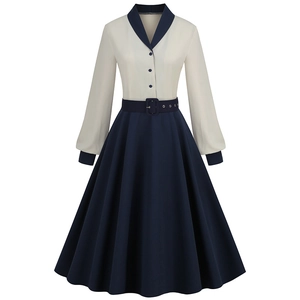 Close-up of contrast V-neckline with navy buttons and white vintage dress collar