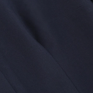 Macro shot of dark blue twill fabric texture with clear diagonal weaving details