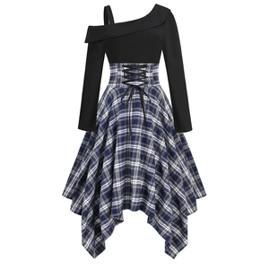 Detail of waist corset with black lace-up drawstring and blue plaid asymmetrical skirt