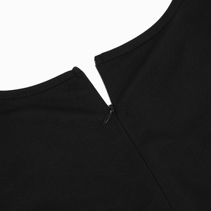 Detailed macro view of the invisible zipper closure on a black V-neck evening dress