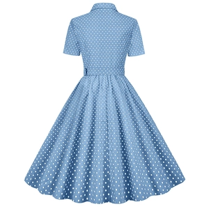 Back view of a vintage sky blue polka dot A-line dress with short sleeves and a waist belt