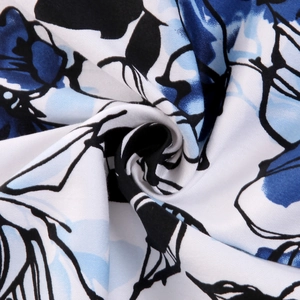 Short sleeve 1950s style dress featuring blue floral print on white woven fabric