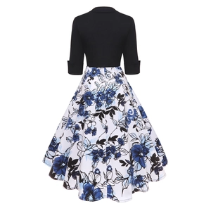 Back view of a vintage 1950s style floral patchwork dress with high waist flared skirt