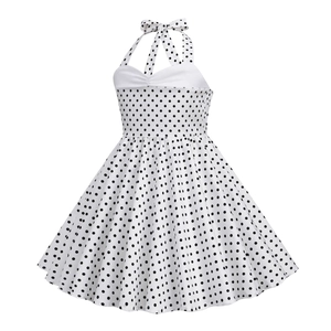 Detailed view of polka dot pattern on halter neck dress with contrast white bodice stitching