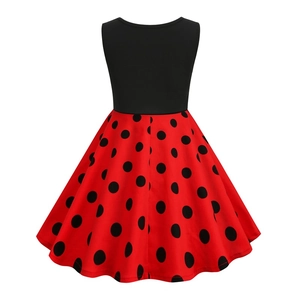 Vintage girls sleeveless dress featuring black bodice and red polka dot A-line skirt