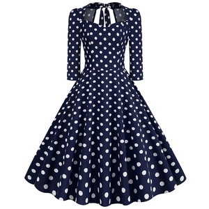 Vintage navy blue polka dot A-line dress with halter neckline and midi sleeves
