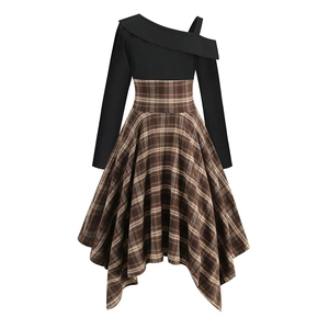 Detail of asymmetrical plaid skirt and one-shoulder bodice on a vintage long sleeve dress