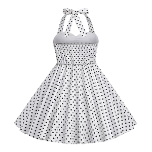 Detailed back view of a retro polka dot girls' halter dress with elastic smocking detail