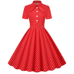 Vintage red short sleeve dress with white polka dots, bow tie collar, and a flared skirt