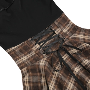 Detail of waist corset lace-up design with metal eyelets and vintage plaid pattern