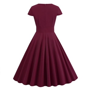 Back view of wine red vintage A-line dress featuring a hidden zipper and flared skirt design