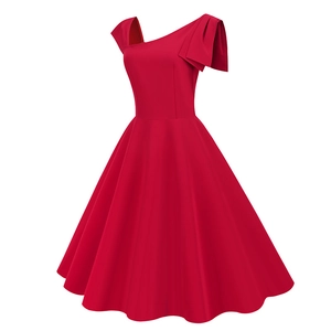 Detail of red one-shoulder vintage dress featuring a large bow on the neckline