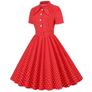 Detailed view of red polka dot vintage A-line dress with pussy-bow neck and buttons