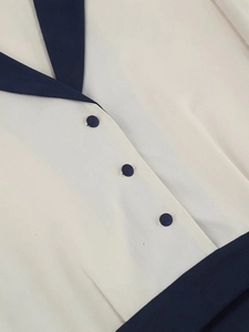 Vintage style black and white patchwork dress with navy collar and button details