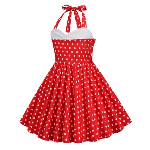 Detailed view of red retro girls dress with halter neck and white polka dot pattern