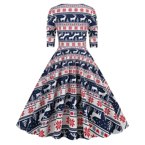Detailed back view of Christmas dress featuring reindeer and snowflake prints in navy blue