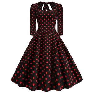 Vintage Audrey Hepburn style polka dot A-line dress with sweetheart neckline and 3/4 sleeves