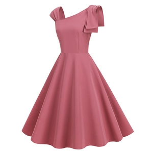 Detail of the elegant one shoulder neckline with an oversized bow on the pink vintage dress