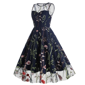 Detailed view of colorful floral embroidery on navy blue sleeveless vintage party dress