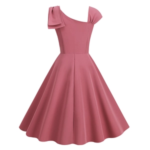 Detail of elegant one-shoulder dress with bow accent and vintage high-waist A-line skirt