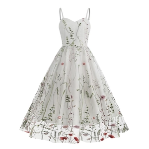 White spaghetti strap dress with vintage green floral embroidery and mesh overlay detail