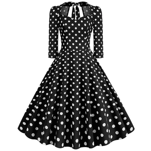 Retro black polka dot dress with A-line skirt and halter neckline in 50s vintage style