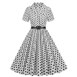 Detail of vintage polka dot dress lapel with black buckle belt on the waist