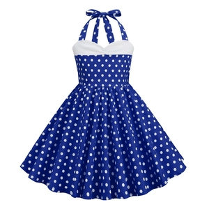 Detail of retro polka dot halter dress featuring a navy bodice and back bow design