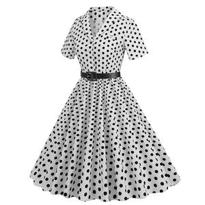 Detailed view of polka dot dress with vintage notched collar and black waist belt