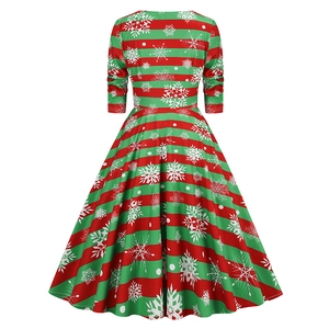 Back view of a Christmas dress with red and green stripes and white snowflakes patterns