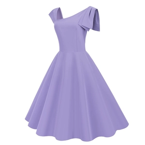Detail of lavender one shoulder vintage dress with large decorative bow on the neckline