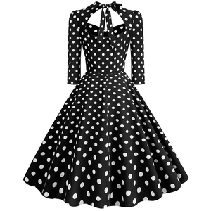 Vintage polka dot flare dress with back cutout and bow tie neck detailing