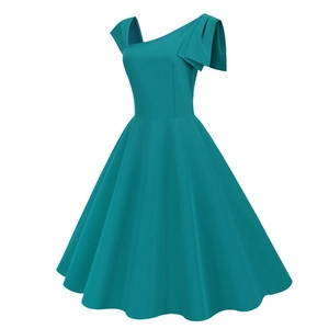 Detail of teal retro one-shoulder dress with decorative pleated bow and wide flared skirt