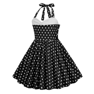 Detail of vintage halter neckline with white trim and polka dot pattern on girl's dress