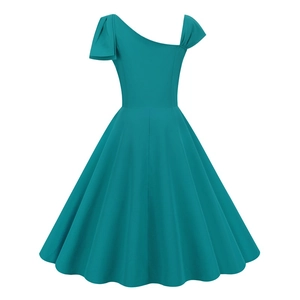 Detail of teal one-shoulder vintage dress showing retro pleats and A-line waist